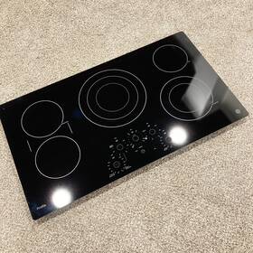 Ge Wb62x43035 Oem Electric Cooktop Black Glass Top - 36 Inch X 20-3/8