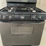 Black Freestanding 4-BURNER Gas Cooking Range W/ Baking Oven, Knob Controls. Fixed Price $220.00.