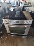 Jenn Air Sstainless Downdraft Range With Black Glass Top. Fixed Price $2500.00.