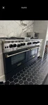 Bluestar 60" Range Double Oven 8 Burners Griddle Stainless Steel Black. Fixed Price $4999.99.