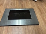 Range Oven Stainless & Black Door Glass Assy WB57K10049. Fixed Price $75.00.
