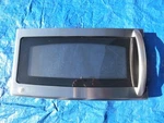 Used Ge Microwave Door Assembly WB56X10717 (stainless). Fixed Price $65.00.